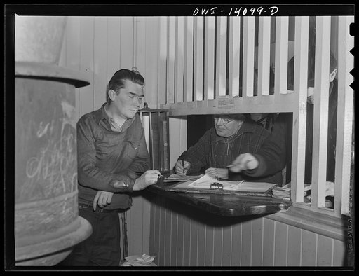 Clinton, Iowa. Train crew getting orders and clearance from the yard clerk in the Chicago and Northwestern Railroad yard office