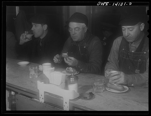 Clinton, Iowa. Train crew of a Chicago and Northwestern train having breakfast before making the trip from Clinton, Iowa to Chicago, Illinois