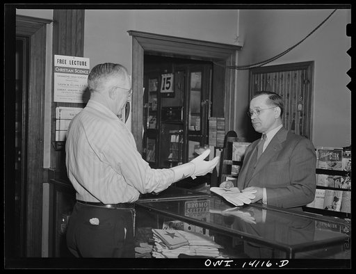 Untitled photo, possibly related to: Gibson, Indiana. Mr. H. O. Wright, engineer on the New York Central and the Indiana Harbor Belt Railroad buying a new pair of gloves at the railroad YMCA (Young Men's Christian Association)