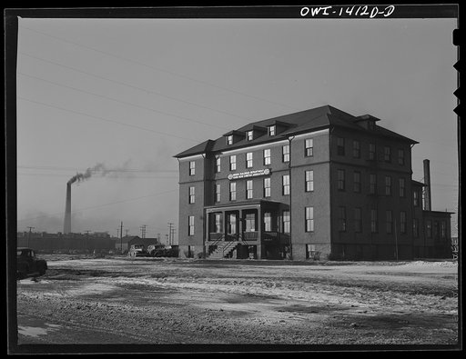 Untitled photo, possibly related to: Gibson, Indiana. The railroad YMCA (Young Men's Christian Association). The stack in the background is from the roundhouse, where the engineers and firemen report for work