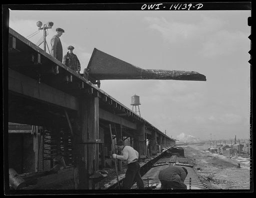 At the icing platform the Indiana Harbor Belt Railroad. The chute is lowered and the ice poured down from the platform above