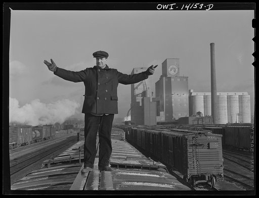 Switchman giving the "go ahead" signal on an Indiana Harbor Belt Railroad train