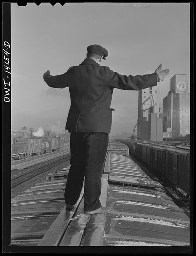 Switchman giving the "go ahead" signal on a train in Blue Island Yard of the Indiana Harbor Belt Railroad