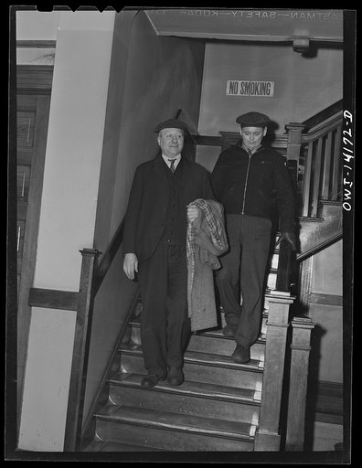 Gibson, Indiana. Engineer George Fisher, left, and fireman John Anderson, leaving the railroad YMCA (Young Men's Christian Association) to go to work. They are both employed on the New York Central Railroad