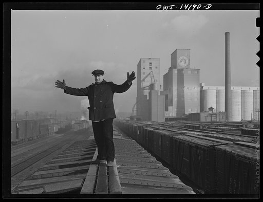 Switchman giving the "go ahead" signal on an Indiana Harbor Belt Railroad train