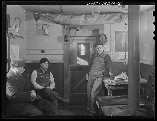 Switchman resting in the hump office while waiting for the next cut to come over at a yard of the Indiana Harbor Belt railroad