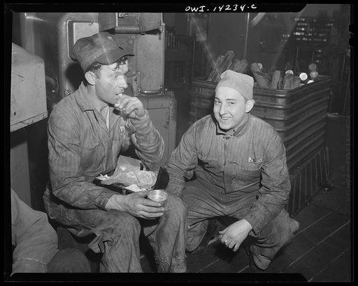Detroit, Michigan. Steps in the manufacture of casings for 105 mm. shells in the Budd wheel plant. Forging machine operators eating lunch