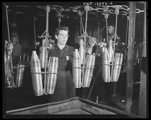 Detroit, Michigan. Steps in the manufacture of casings for 105 mm. shells in the Budd wheel plant. Conveyor to the painting and packing department