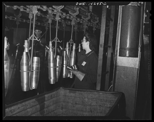 Detroit, Michigan. Steps in the manufacture of casings for 105 mm. shells in the Budd wheel plant. Conveyor to the painting and packing department