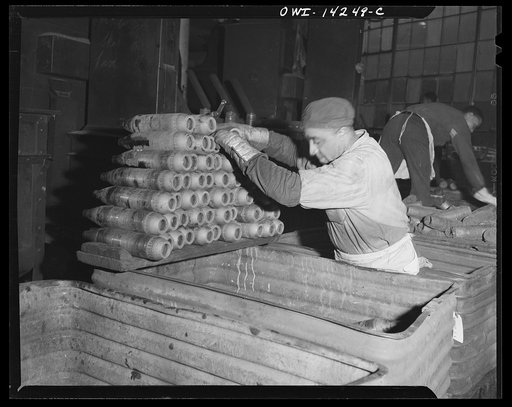 Detroit, Michigan. Steps in the manufacture of casings for 105 mm. shells in the Budd wheel plant. 81 mm. forgings ready for the finishing machine after shot blastings