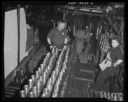 Untitled photo, possibly related to: Detroit, Michigan. Steps in the manufacture of casings for 105 mm. shells in the Budd wheel plant. Stamping shell for identification