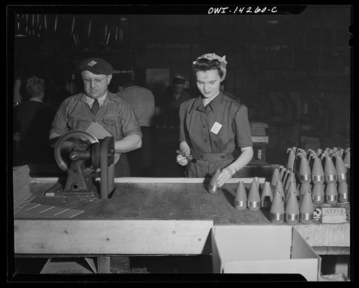 Untitled photo, possibly related to: Detroit, Michigan. Steps in the maufacture of casings for 105 mm. shells in the Budd wheel plant. Women inspecting 60 mm. shells