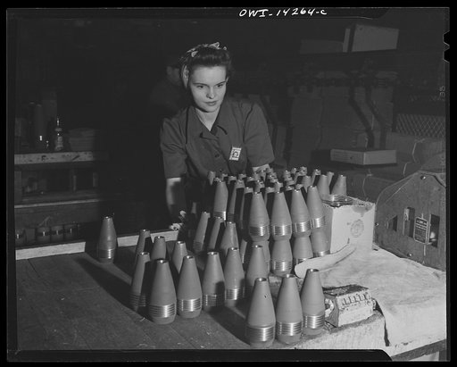 Detroit, Michigan. Steps in the maufacture of casings for 105 mm. shells in the Budd wheel plant. Women inspecting 60 mm. shells