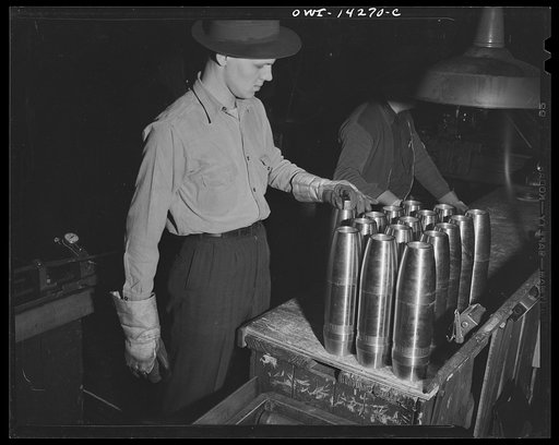 Detroit, Michigan. Steps in the maufacture of casings for 105 mm. shells in the Budd wheel plant. Process inspection of shells