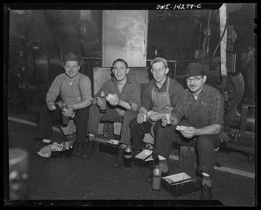Detroit, Michigan. Steps in the manufacture of casings for 105 mm. shells in the Budd wheel plant. Machine operators eating lunch