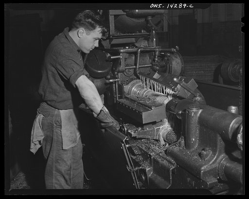 Detroit, Michigan. Steps in the manufacture of casings for 105 mm. shells in the Budd wheel plant. Rough turning a shell