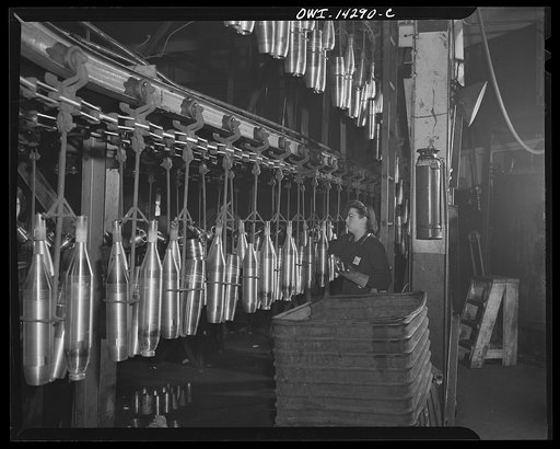 Detroit, Michigan. Steps in the manufacture of casings for 105 mm. shells in the Budd wheel plant. Conveyor to the painting and packing department