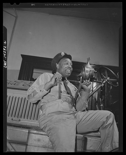 Firehouse station number four. Washington, D.C. One of the veteran firemen who used to travel with an oldtime minstrel show as an end man