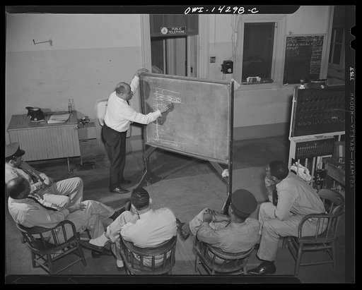 Firehouse station number four. Washington, D.C. Lieutenant Mills giving a lesson in water pressure to new firemen who serve a year's probation period