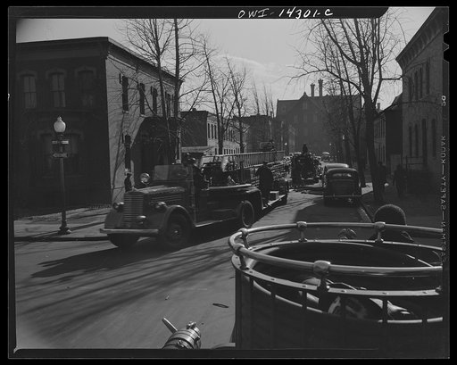 Firehouse station number four. Washington, D.C. Firemen leaving the scene of a small fire