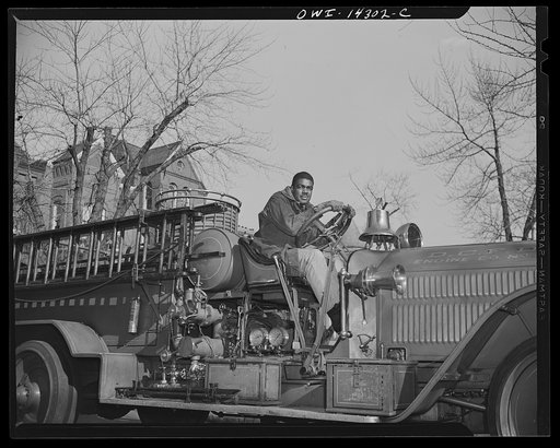 Firehouse station number four. Washington, D.C. Paul Honesty, a young fireman who was a former grid star at Howard University