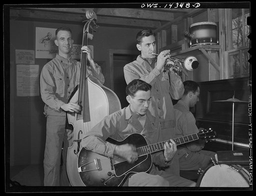 Fort Belvoir, Virginia. Private Thomas Cavallaro playing a trumpet. His parents were born in Italy
