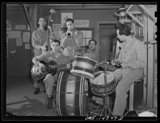 Fort Belvoir, Virginia. Private Thomas Cavallaro playing a trumpet. His parents were born in Italy