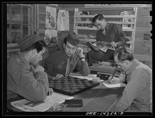 Fort Belvoir, Virginia. Private Dalto and Sergeant Tauro playing checkers in the recreation hall
