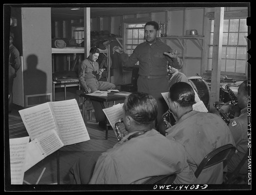 Fort Belvoir, Virginia. Sergeant Bianco (with watch in hand) at a rehearsal of a band for a radio show