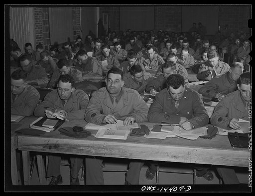 Untitled photo, possibly related to: Fort Belvoir, Virginia. Compass reading class in the Officer Candidates' School. Candidates Joseph Passarello and Frank Frangipane are in the foreground. The parents of both of these men were born in Italy
