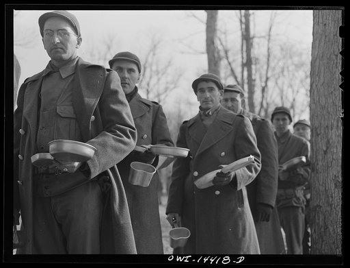 Untitled photo, possibly related to: Fort Belvoir, Virginia. Soldier of Italian descent waiting with his mess kit for noon "chow"