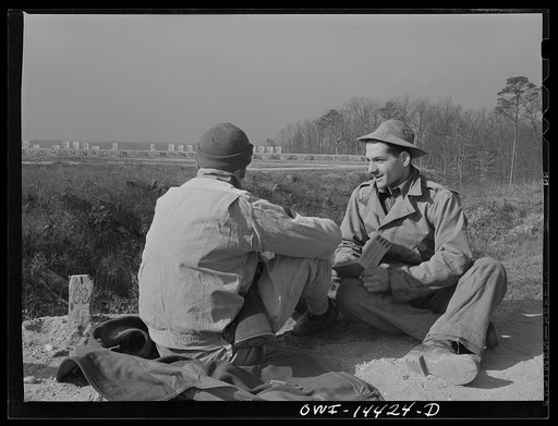 Fort Belvoir, Virginia. Daniel Masciolli on the rifle range coaching a soldier who is learning how to shoot