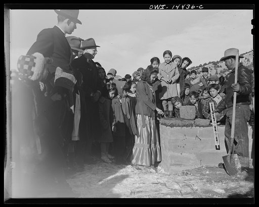 Untitled photo, possibly related to: Penasco, New Mexico. Laying the corner adobe of the new building for the clinic operated by the Taos County cooperative health association