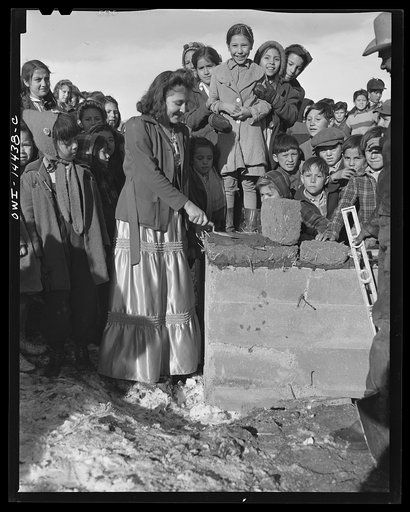 Untitled photo, possibly related to: Penasco, New Mexico. Laying the corner adobe of the new building for the clinic operated by the Taos County cooperative health association