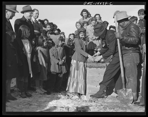 Penasco, New Mexico. Laying the corner adobe of the new building for the clinic operated by the Taos County cooperative health association