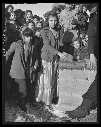 Untitled photo, possibly related to: Penasco, New Mexico. Laying the corner adobe of the new building for the clinic operated by the Taos County cooperative health association