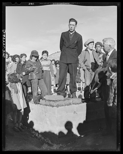 Untitled photo, possibly related to: Penasco, New Mexico. Father Cassidy speaking at the dedication of the new building for the clinic operated by the Taos County cooperative health association