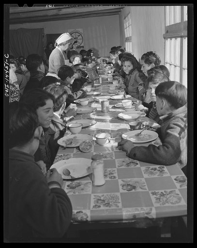 Penasco, New Mexico. Hot lunch provided by community support at a grade and high school administered by the Roman Catholic church