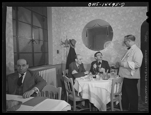Untitled photo, possibly related to: New York, New York. John's Restaurant on Twelfth Street near Second Avenue is a haunt of Italian journalists and intellectuals. At the rear table, with glasses, is Girolamo Valente, editor of La Parola