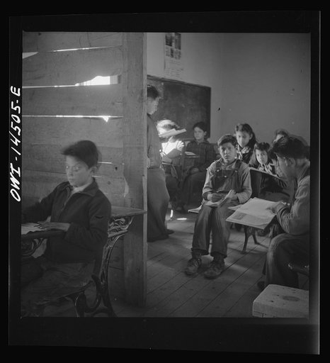 Ojo Sarco, New Mexico. One-room school in an isolated mountainous Spanish-American community, which has eight grades and two teachers. Most of the teaching is in Spanish, the language spoken in the children's homes, and as a result they rarely speak English fluently