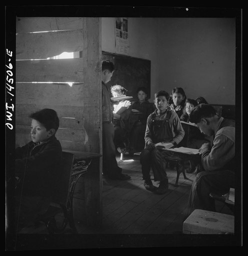 Ojo Sarco, New Mexico. One-room school in an isolated mountainous Spanish-American community, which has eight grades and two teachers. Most of the teaching is in Spanish, the language spoken in the children's homes, and as a result they rarely speak English fluently