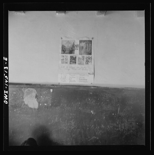 Untitled photo, possibly related to: Ojo Sarco, New Mexico. One-room school in an isolated mountainous Spanish-American community, which has eight grades and two teachers. Most of the teaching is in Spanish, the language spoken in the children's homes, and as a result they rarely speak English fluen