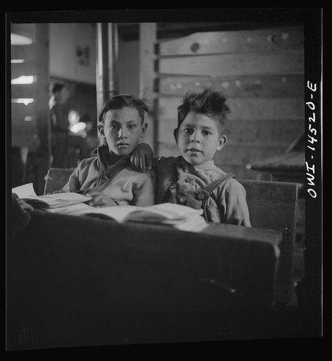 Ojo Sarco, New Mexico. One-room school in an isolated mountainous Spanish-American community, which has eight grades and two teachers. Most of the teaching is in Spanish, the language spoken in the children's homes, and as a result they rarely speak English fluently