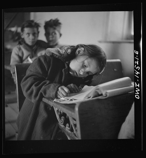 Ojo Sarco, New Mexico. One-room school in an isolated mountainous Spanish-American community, which has eight grades and two teachers. Most of the teaching is in Spanish, the language spoken in the children's homes, and as a result they rarely speak English fluently