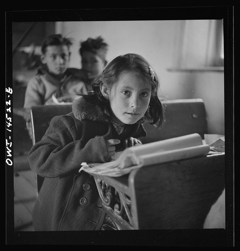 Ojo Sarco, New Mexico. One-room school in an isolated mountainous Spanish-American community, which has eight grades and two teachers. Most of the teaching is in Spanish, the language spoken in the children's homes, and as a result they rarely speak English fluently