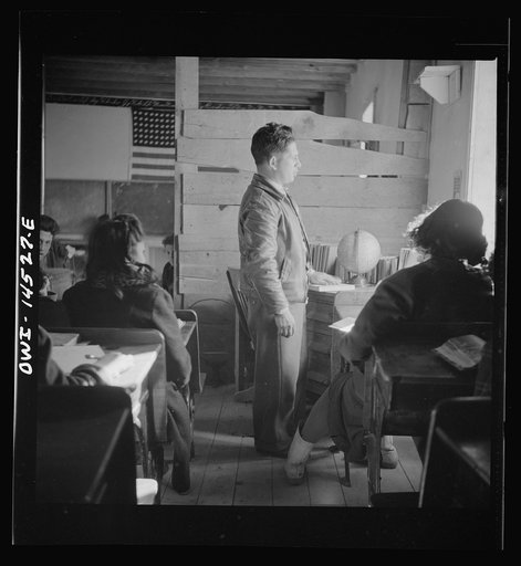 Untitled photo, possibly related to: Ojo Sarco, New Mexico. One-room school in an isolated mountainous Spanish-American community, which has eight grades and two teachers. Most of the teaching is in Spanish, the language spoken in the children's homes, and as a result they rarely speak English fluen