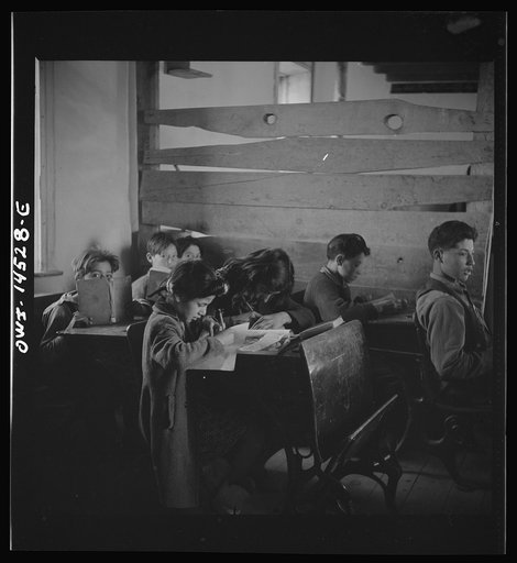 Ojo Sarco, New Mexico. One-room school in an isolated mountainous Spanish-American community, which has eight grades and two teachers. Most of the teaching is in Spanish, the language spoken in the children's homes, and as a result they rarely speak English fluently