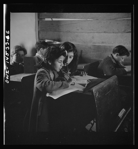 Ojo Sarco, New Mexico. One-room school in an isolated mountainous Spanish-American community, which has eight grades and two teachers. Most of the teaching is in Spanish, the language spoken in the children's homes, and as a result they rarely speak English fluently