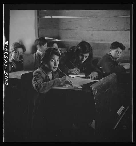 Ojo Sarco, New Mexico. One-room school in an isolated mountainous Spanish-American community, which has eight grades and two teachers. Most of the teaching is in Spanish, the language spoken in the children's homes, and as a result they rarely speak English fluently