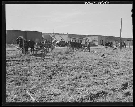 Penasco, New Mexico. Wagons hitched in front of the clinic operated by the Taos County cooperative health association